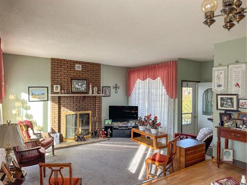 5319 Robinson Place, Bashaw, AB - Indoor Photo Showing Living Room With Fireplace