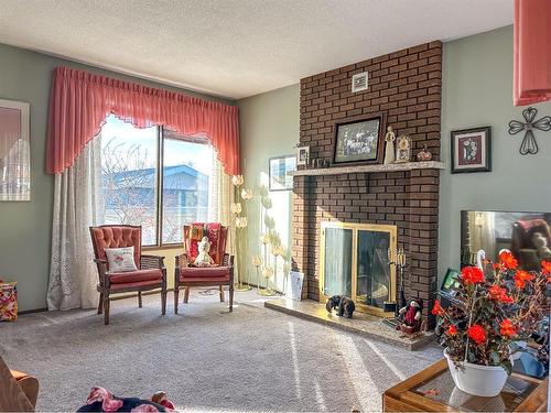 5319 Robinson Place, Bashaw, AB - Indoor Photo Showing Living Room With Fireplace