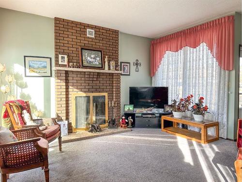 5319 Robinson Place, Bashaw, AB - Indoor Photo Showing Living Room With Fireplace