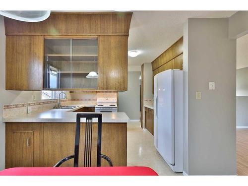 5704 42 Avenue, Camrose, AB - Indoor Photo Showing Kitchen With Double Sink