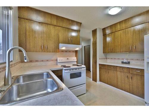 5704 42 Avenue, Camrose, AB - Indoor Photo Showing Kitchen With Double Sink