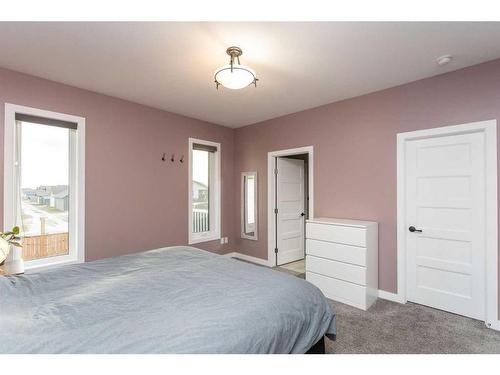 41 Mackenzie Avenue, Lacombe, AB - Indoor Photo Showing Bedroom