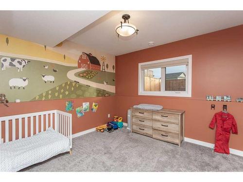 41 Mackenzie Avenue, Lacombe, AB - Indoor Photo Showing Bedroom