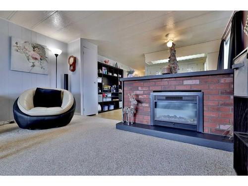 5421 50 Street, Camrose, AB - Indoor Photo Showing Living Room With Fireplace