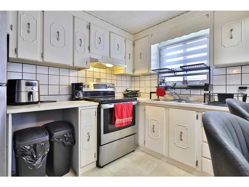 5421 50 Street, Camrose, AB - Indoor Photo Showing Kitchen With Double Sink