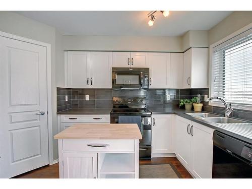 2203-30 Carleton Avenue West, Red Deer, AB - Indoor Photo Showing Kitchen With Double Sink