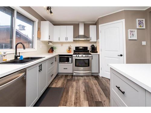 13 Crawford Street, Red Deer, AB - Indoor Photo Showing Kitchen With Double Sink