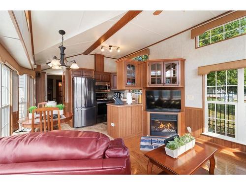 125-25173 Township Road 364, Rural Red Deer County, AB - Indoor Photo Showing Living Room With Fireplace