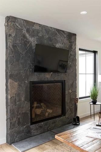 132 Meadow Ponds Drive, Rural Clearwater County, AB - Indoor Photo Showing Living Room With Fireplace