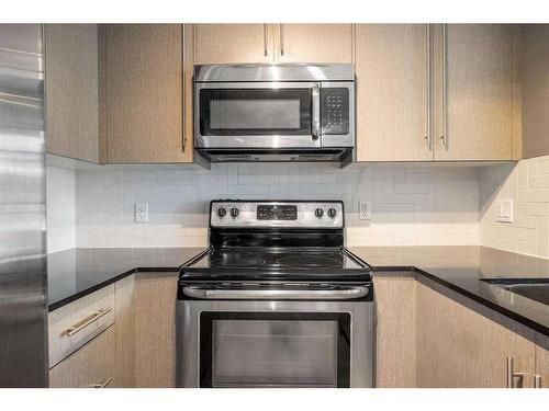 1210-11 Mahogany Row Se, Calgary, AB - Indoor Photo Showing Kitchen With Stainless Steel Kitchen