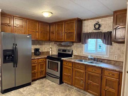 4927 49 Street, Lougheed, AB - Indoor Photo Showing Kitchen With Stainless Steel Kitchen With Double Sink