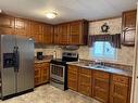 4927 49 Street, Lougheed, AB  - Indoor Photo Showing Kitchen With Stainless Steel Kitchen With Double Sink 