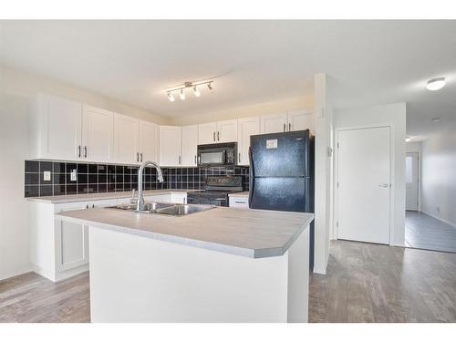 4-20 Jacobs Close, Red Deer, AB - Indoor Photo Showing Kitchen With Double Sink