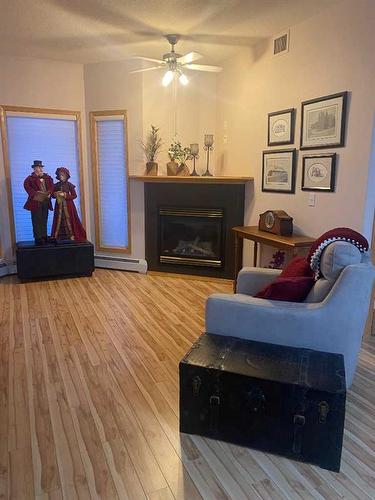 305-5300 48 Street, Red Deer, AB - Indoor Photo Showing Living Room With Fireplace