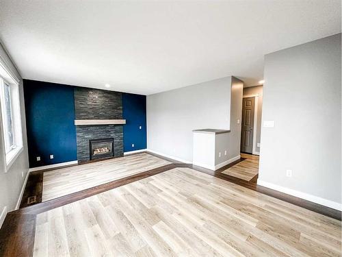 4108 65A Street, Stettler, AB - Indoor Photo Showing Living Room With Fireplace