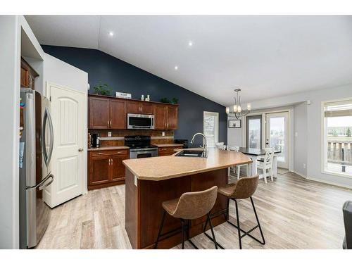 70 Rozier Close, Sylvan Lake, AB - Indoor Photo Showing Kitchen With Double Sink