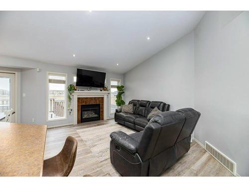 70 Rozier Close, Sylvan Lake, AB - Indoor Photo Showing Living Room With Fireplace