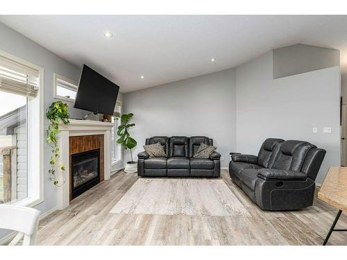 70 Rozier Close, Sylvan Lake, AB - Indoor Photo Showing Living Room With Fireplace