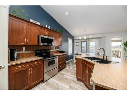 70 Rozier Close, Sylvan Lake, AB - Indoor Photo Showing Kitchen With Double Sink