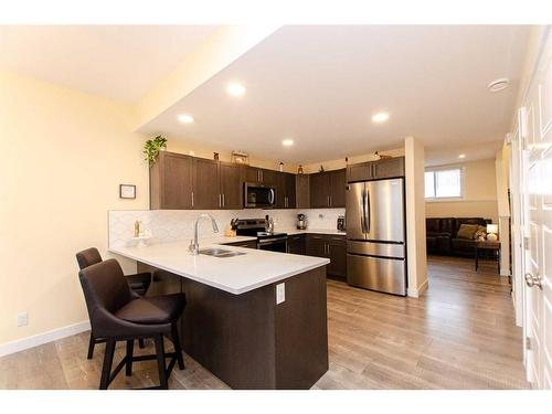 4086 Ryders Ridge Boulevard, Sylvan Lake, AB - Indoor Photo Showing Kitchen With Double Sink