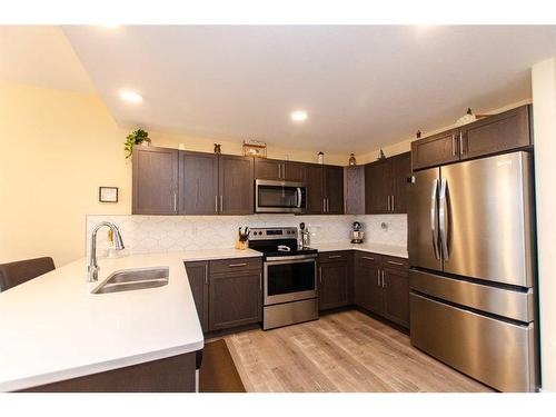 4086 Ryders Ridge Boulevard, Sylvan Lake, AB - Indoor Photo Showing Kitchen With Double Sink