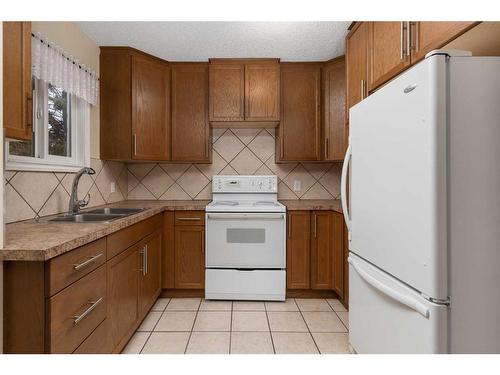 117 Bateson Street, Bittern Lake, AB - Indoor Photo Showing Kitchen With Double Sink