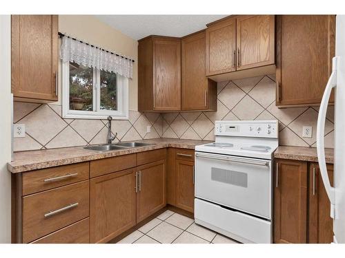 117 Bateson Street, Bittern Lake, AB - Indoor Photo Showing Kitchen With Double Sink