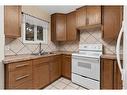 117 Bateson Street, Bittern Lake, AB  - Indoor Photo Showing Kitchen With Double Sink 