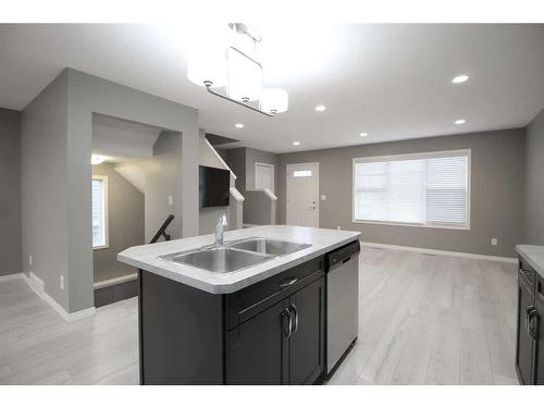 15 Hampton Crescent, Sylvan Lake, AB - Indoor Photo Showing Kitchen With Double Sink