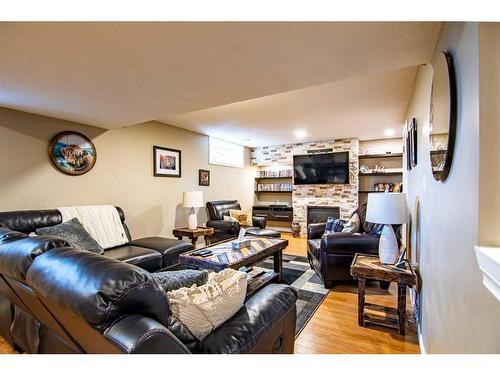 16 Mckinlay Crescent, Lacombe, AB - Indoor Photo Showing Living Room With Fireplace