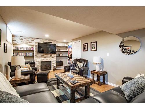 16 Mckinlay Crescent, Lacombe, AB - Indoor Photo Showing Living Room With Fireplace