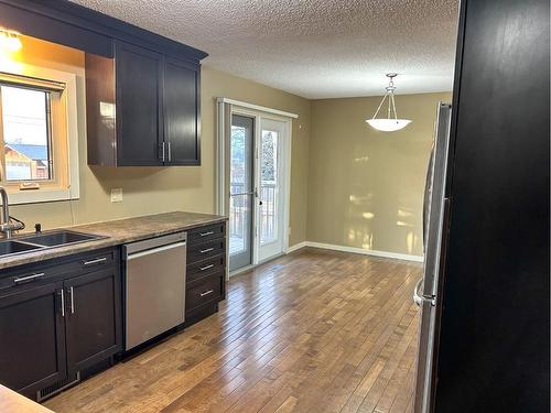 5411 51 Avenue, Rocky Mountain House, AB - Indoor Photo Showing Kitchen With Double Sink