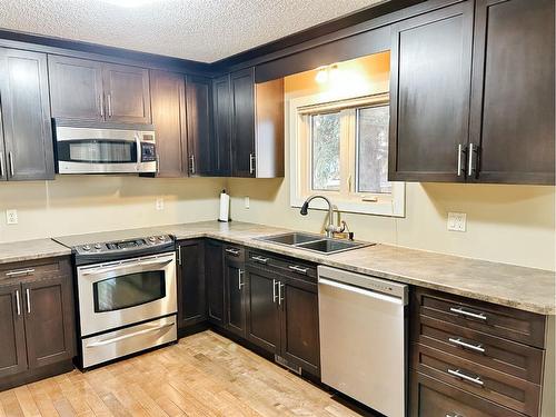 5411 51 Avenue, Rocky Mountain House, AB - Indoor Photo Showing Kitchen With Double Sink