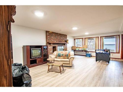 181 Grand Avenue, Norglenwold, AB - Indoor Photo Showing Other Room With Fireplace