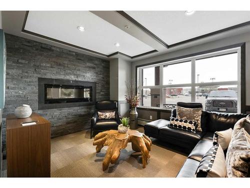 2206-10 Market Boulevard, Airdrie, AB - Indoor Photo Showing Living Room With Fireplace