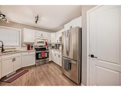 4319 55 Avenue Crescent, Innisfail, AB - Indoor Photo Showing Kitchen With Double Sink