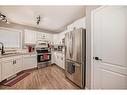 4319 55 Avenue Crescent, Innisfail, AB  - Indoor Photo Showing Kitchen With Double Sink 