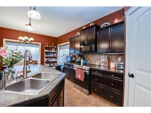 67 Burris Pointe, Lacombe, AB - Indoor Photo Showing Kitchen With Double Sink