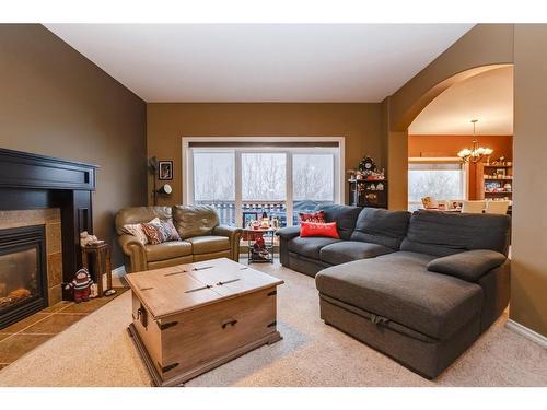 67 Burris Pointe, Lacombe, AB - Indoor Photo Showing Living Room With Fireplace