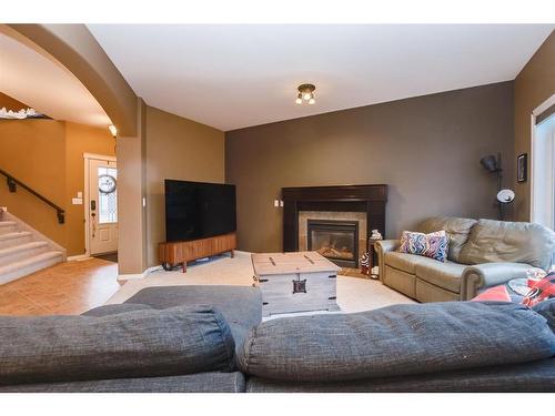 67 Burris Pointe, Lacombe, AB - Indoor Photo Showing Living Room With Fireplace