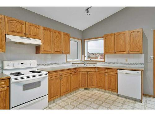 15 Hagerman Road, Sylvan Lake, AB - Indoor Photo Showing Kitchen With Double Sink