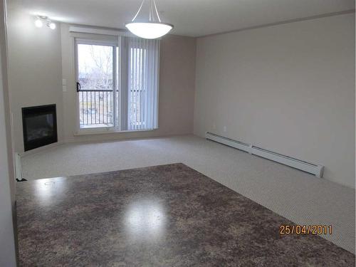 307-5601 Kerrywood Drive, Red Deer, AB - Indoor Photo Showing Other Room With Fireplace