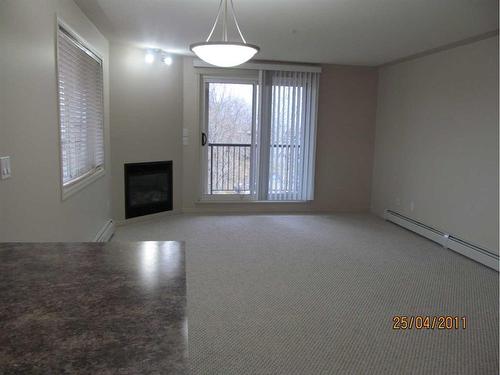 307-5601 Kerrywood Drive, Red Deer, AB - Indoor Photo Showing Other Room With Fireplace