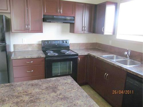 307-5601 Kerrywood Drive, Red Deer, AB - Indoor Photo Showing Kitchen With Double Sink