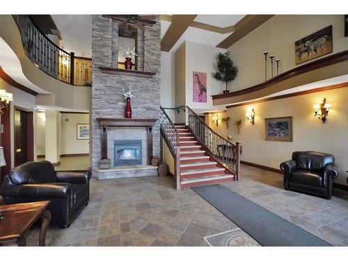 324-5300 48 Street, Red Deer, AB - Indoor With Fireplace