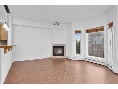 324-5300 48 Street, Red Deer, AB - Indoor Photo Showing Living Room With Fireplace