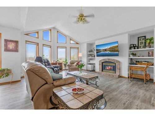 4-27111 Highway 597, Rural Lacombe County, AB - Indoor Photo Showing Living Room With Fireplace