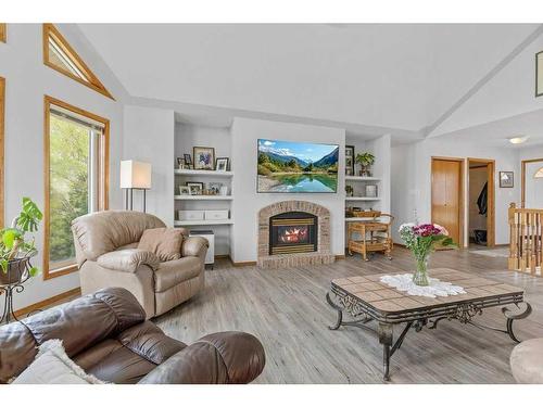 4-27111 Highway 597, Rural Lacombe County, AB - Indoor Photo Showing Living Room With Fireplace