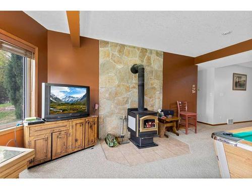 4-27111 Highway 597, Rural Lacombe County, AB - Indoor Photo Showing Other Room With Fireplace