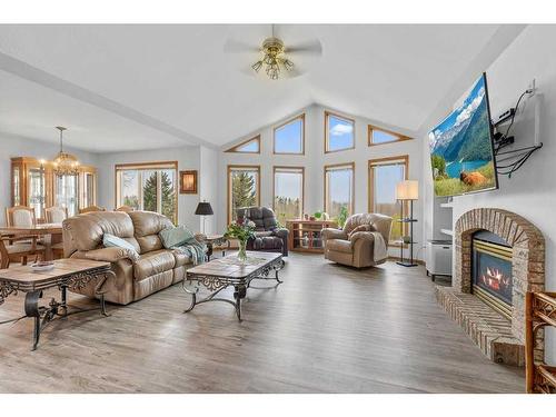 4-27111 Highway 597, Rural Lacombe County, AB - Indoor Photo Showing Living Room With Fireplace